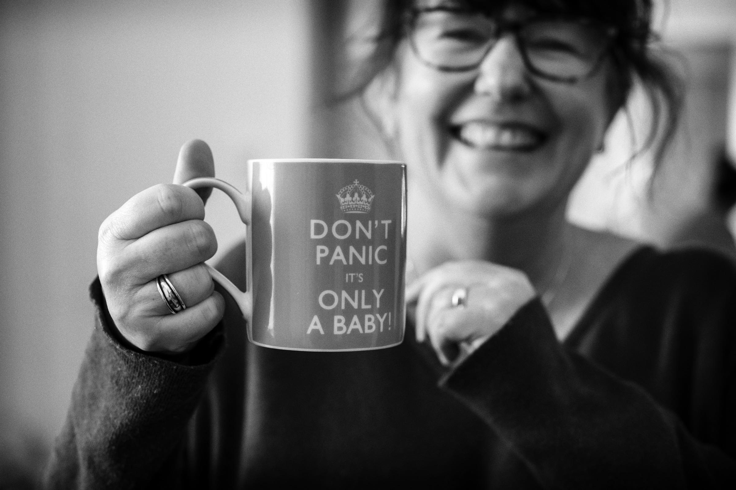 Private Midwife in the Blue Mountains holding a mug of tea she is having after attending a homebirth.